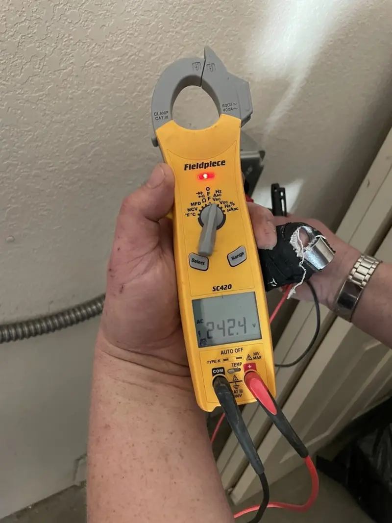 Voltage testing with clamp meter during Outlet Installation in Cypress
